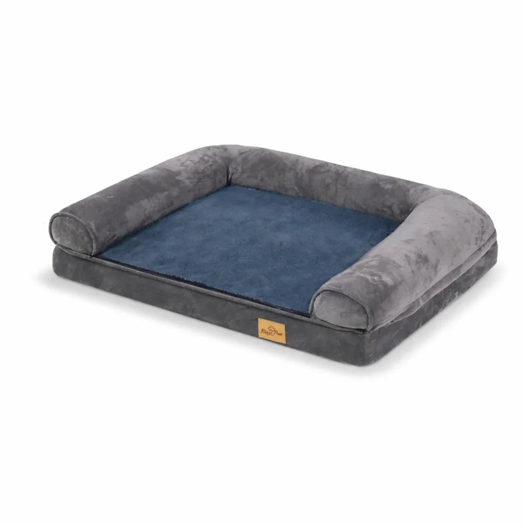 Orthopedic dog bed with gray bolster sides and blue cushioned sleeping area on white background